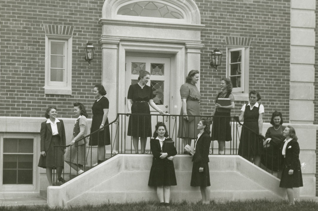 A black and white photograph of women on the steps of Love Memorial Hall
