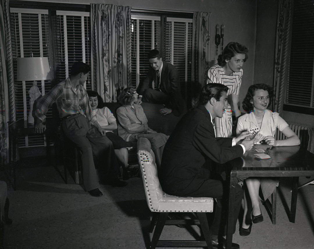 A black and white photo of students in a game parlor