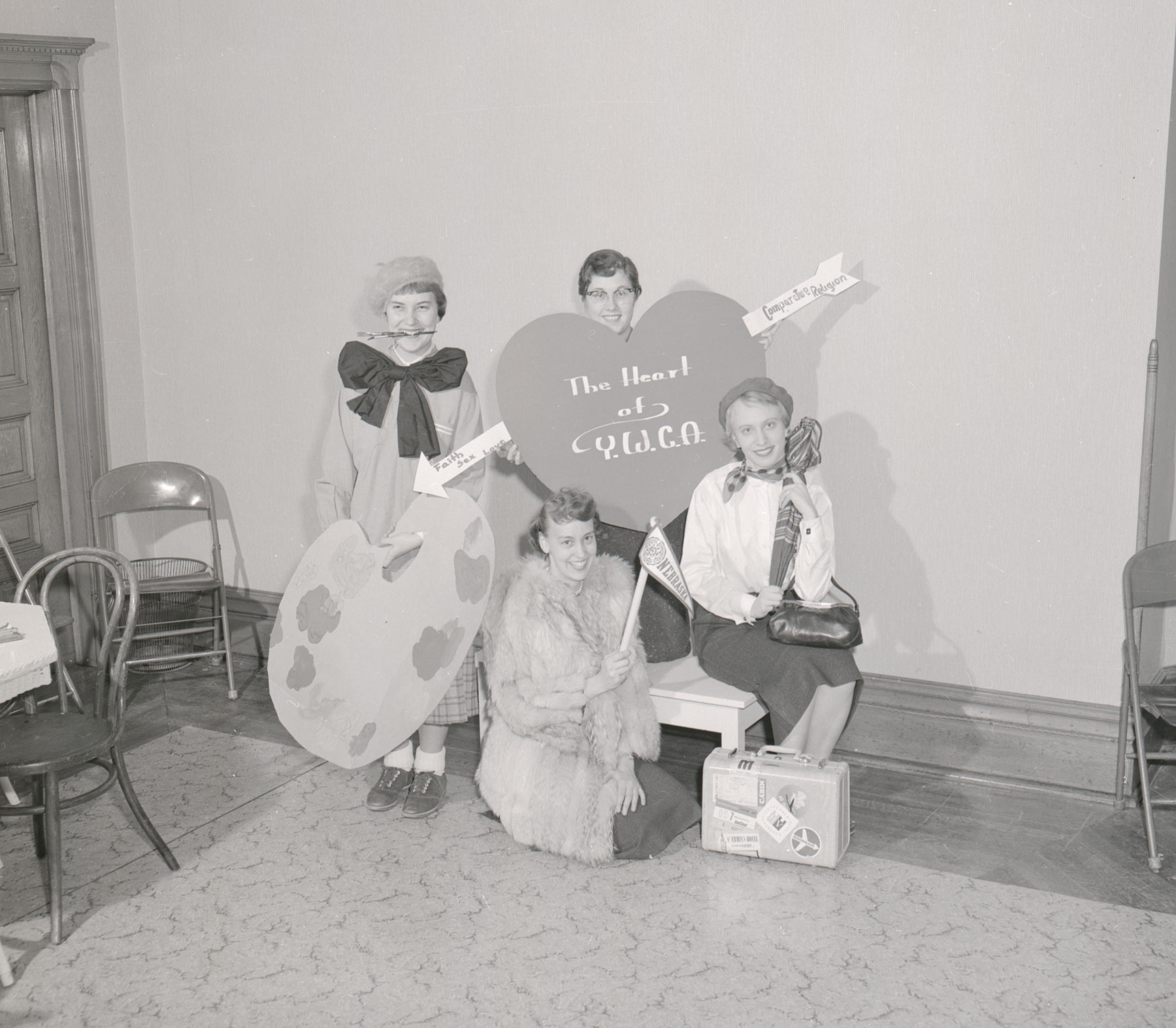 A black and white image of young women in Halloween costumes